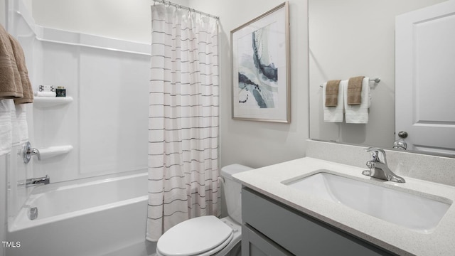 full bath featuring vanity, shower / bath combination with curtain, and toilet