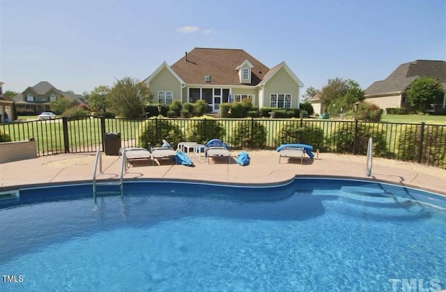 view of pool featuring a patio area, fence, and a fenced in pool