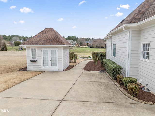 view of patio / terrace with an outbuilding