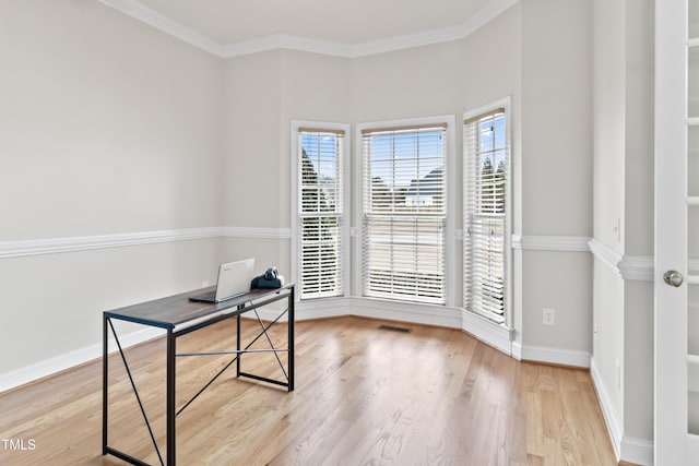 office space featuring ornamental molding, wood finished floors, visible vents, and baseboards