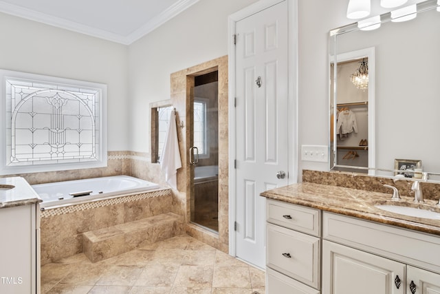 full bath featuring ornamental molding, a garden tub, vanity, and a shower stall