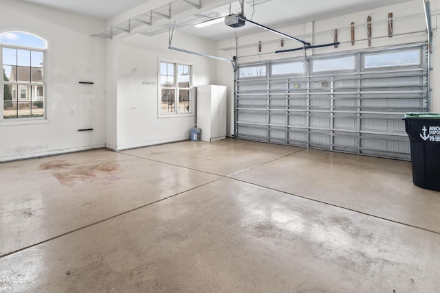 garage featuring baseboards and a garage door opener