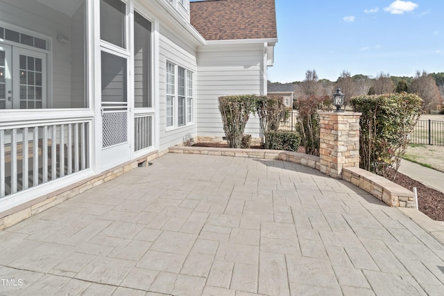 view of patio featuring fence