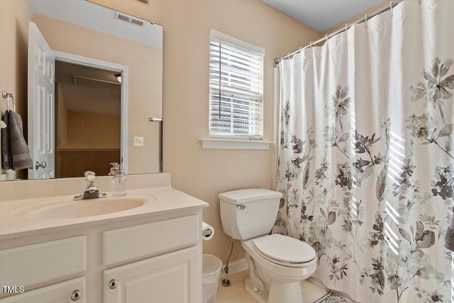 full bathroom featuring curtained shower, visible vents, toilet, vanity, and tile patterned flooring