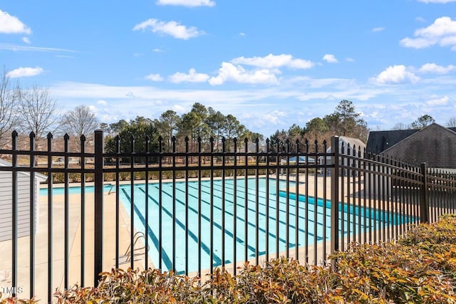 community pool featuring fence