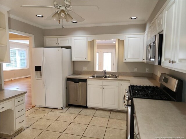 2814 Millbrook Rd, Fayetteville, NC 28303 - kitchen with white cabinetry, crown molding, appliances with stainless steel finishes, and a sink