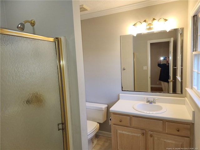 2814 Millbrook Rd, Fayetteville, NC 28303 - bathroom featuring ornamental molding, a stall shower, vanity, and toilet