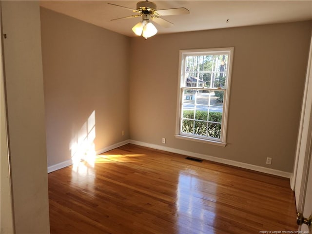 2814 Millbrook Rd, Fayetteville, NC 28303 - empty room featuring a ceiling fan, visible vents, baseboards, and wood finished floors