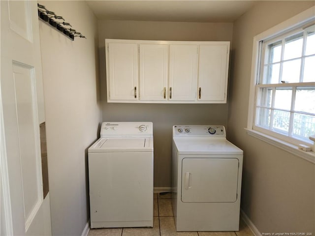 2814 Millbrook Rd, Fayetteville, NC 28303 - laundry room with baseboards, light tile patterned floors, cabinet space, and washer and dryer