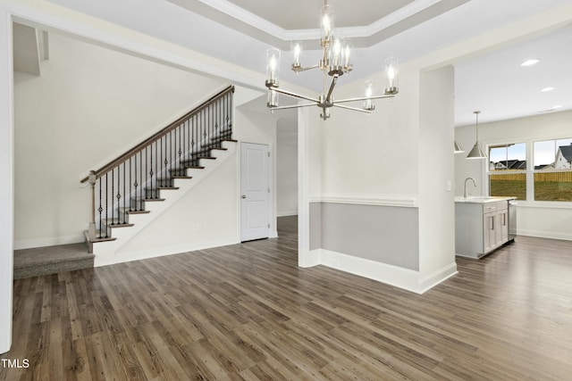 interior space featuring a sink, baseboards, stairway, and dark wood-type flooring