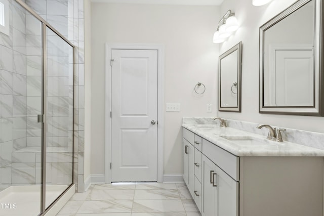 full bathroom featuring marble finish floor, a shower stall, and a sink