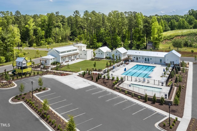 birds eye view of property with a wooded view