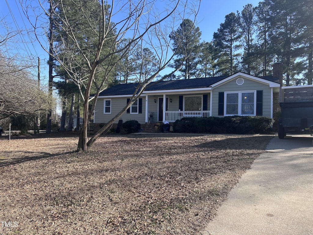 ranch-style house featuring a porch