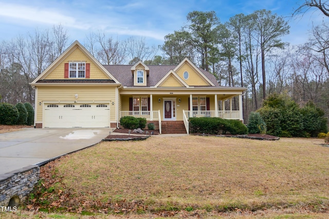 craftsman house featuring covered porch, concrete driveway, and a front yard