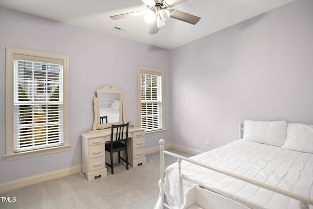 bedroom featuring ceiling fan, carpet floors, visible vents, and baseboards