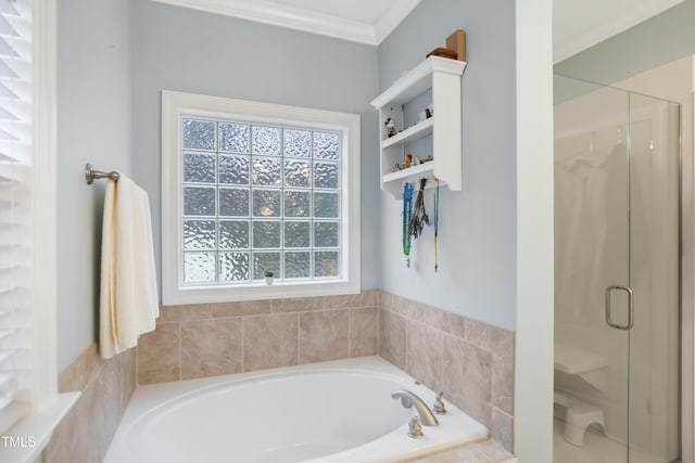 full bath with a shower stall, a bath, and crown molding