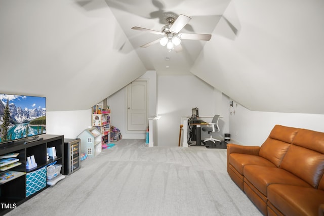 interior space with carpet floors, vaulted ceiling, and ceiling fan