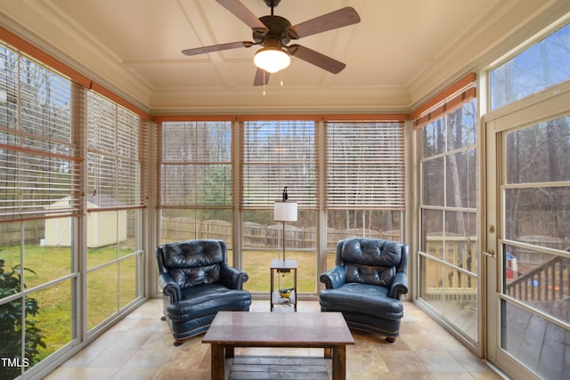 sunroom featuring ceiling fan