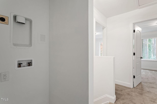 hallway with baseboards and carpet floors