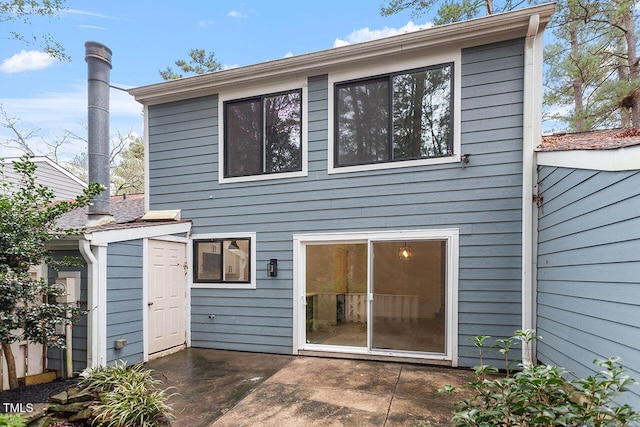 back of house with a patio