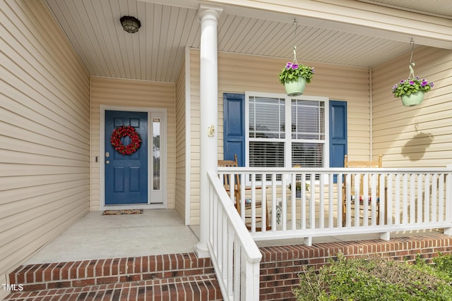 doorway to property with a porch