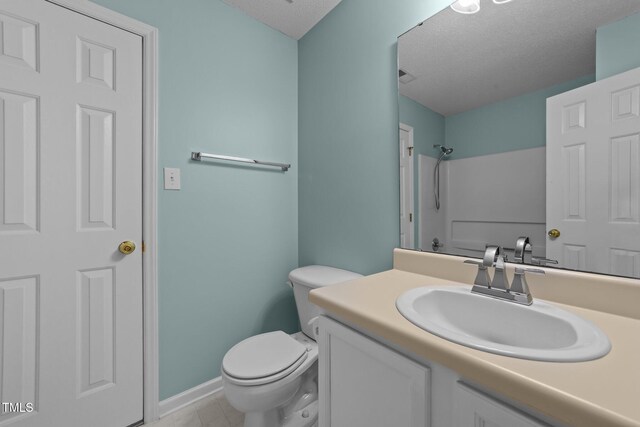 full bath with visible vents, toilet, walk in shower, a textured ceiling, and vanity