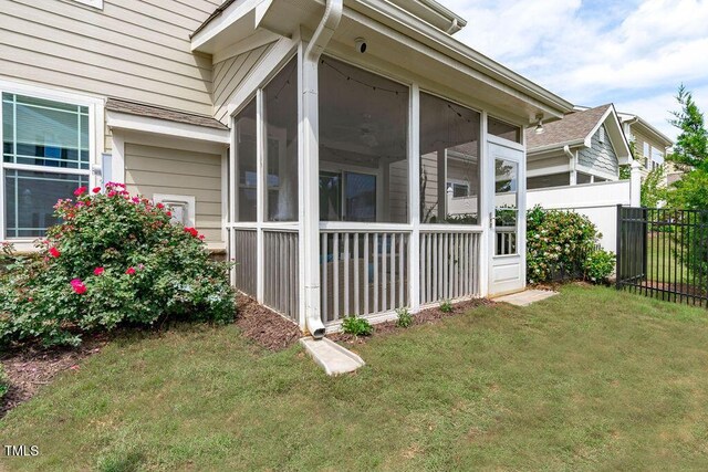 view of side of property with a sunroom