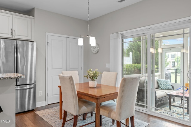 dining room featuring dark wood-style floors