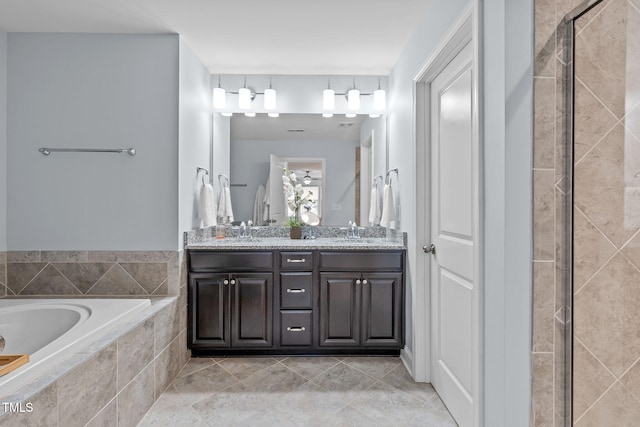 full bathroom with a garden tub, a stall shower, double vanity, and tile patterned floors