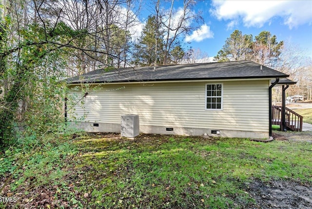 view of home's exterior featuring a yard and crawl space