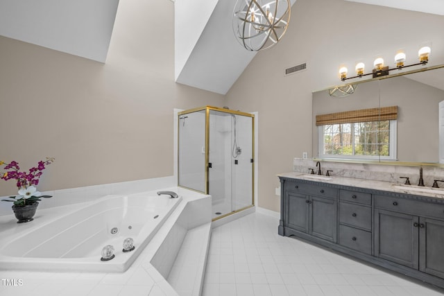 full bathroom with visible vents, double vanity, a whirlpool tub, a sink, and a shower stall