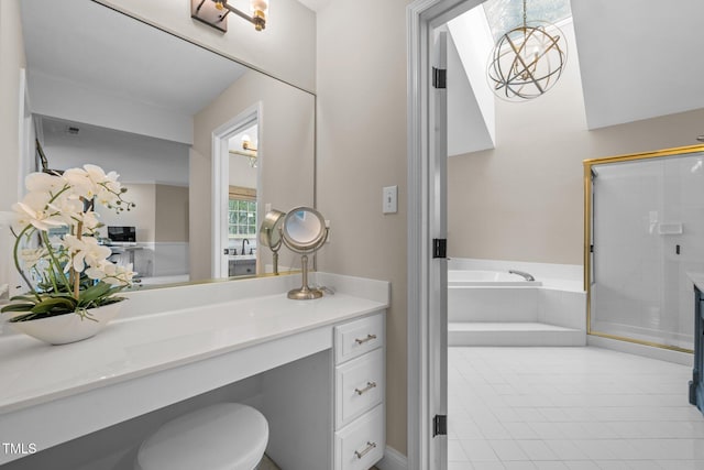 full bathroom featuring vanity, a garden tub, a stall shower, and tile patterned floors