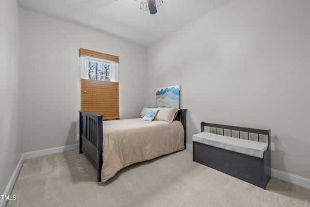 bedroom with carpet flooring and baseboards