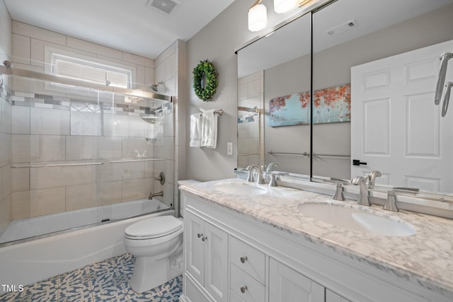 bathroom with a sink, visible vents, and toilet