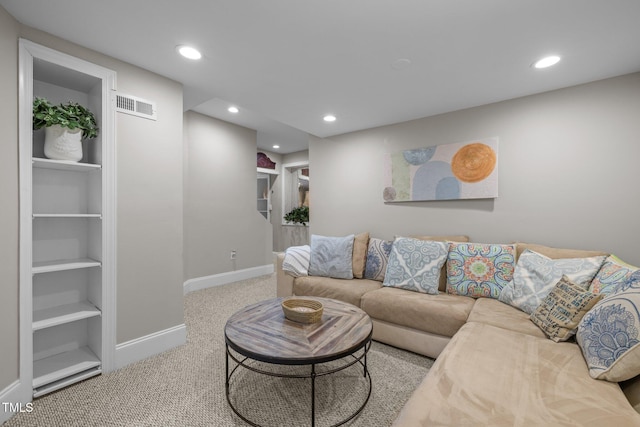 living room featuring visible vents, built in features, recessed lighting, carpet, and baseboards