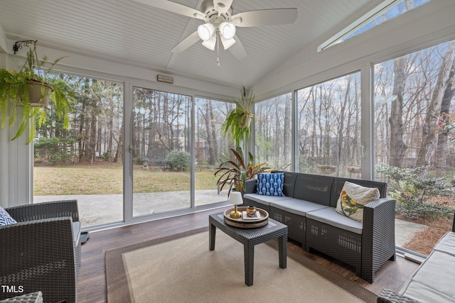 sunroom / solarium featuring lofted ceiling and a ceiling fan