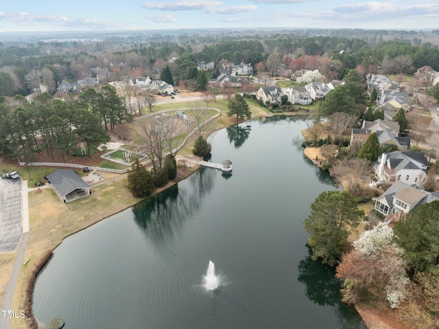 drone / aerial view with a water view and a residential view