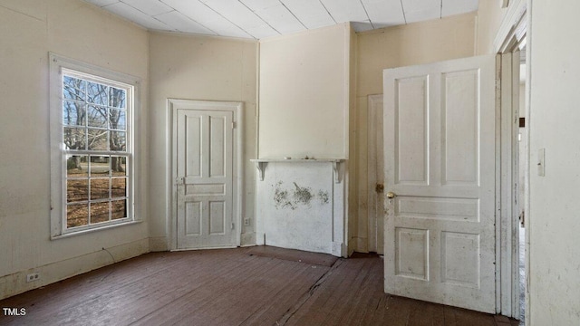 interior space featuring plenty of natural light and hardwood / wood-style flooring