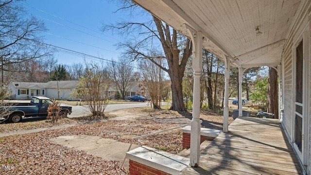 view of yard featuring covered porch