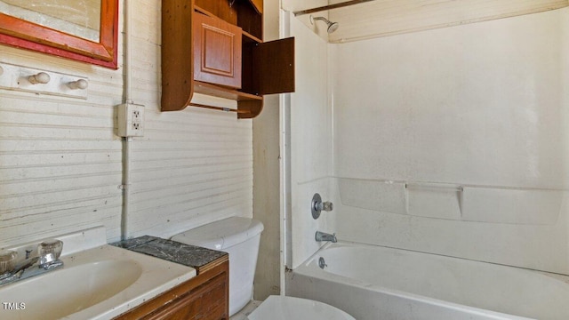 bathroom with toilet, washtub / shower combination, and vanity