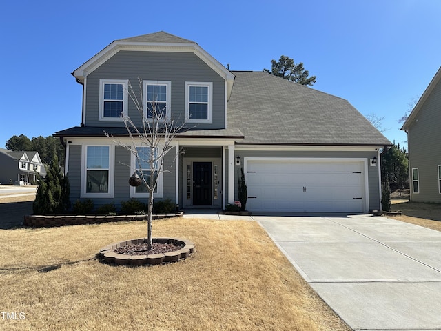 traditional-style home with a garage and driveway