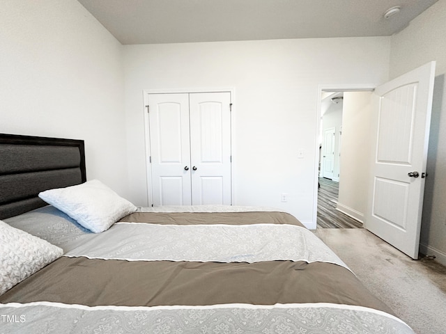 bedroom featuring carpet floors, a closet, and baseboards