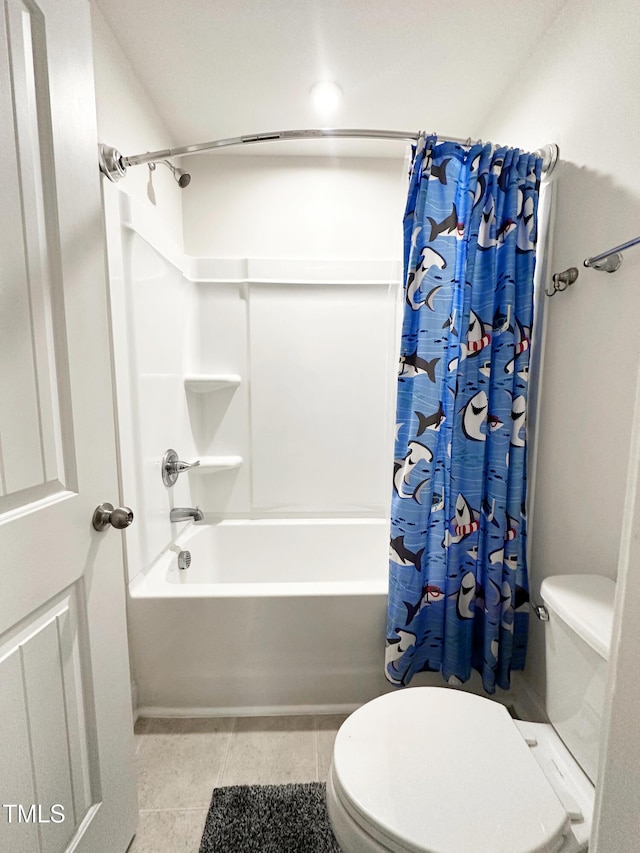 full bathroom with toilet, shower / tub combo, and tile patterned floors