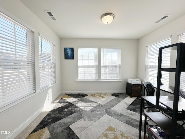 home office with visible vents and baseboards