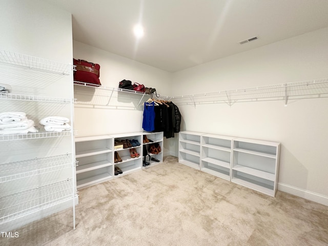 walk in closet with carpet and visible vents