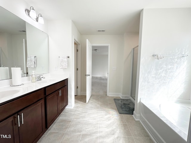 bathroom featuring a stall shower, visible vents, a sink, and a bath