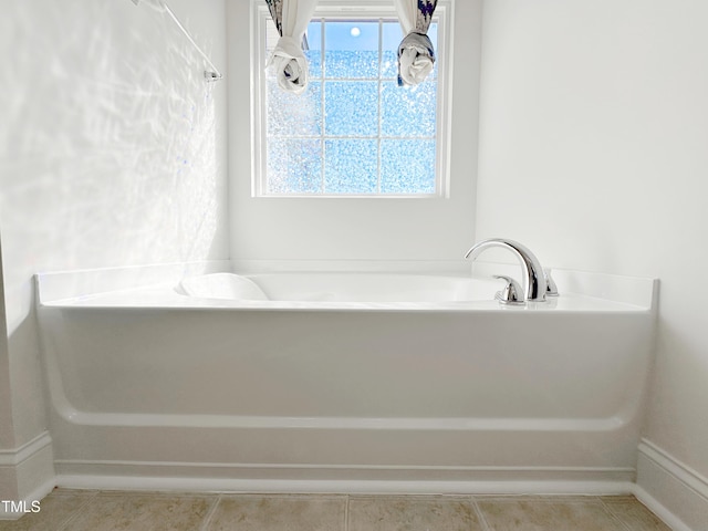 full bathroom with tile patterned flooring and a bathtub