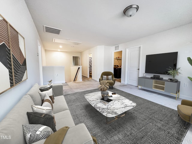 living area featuring carpet floors, visible vents, and baseboards