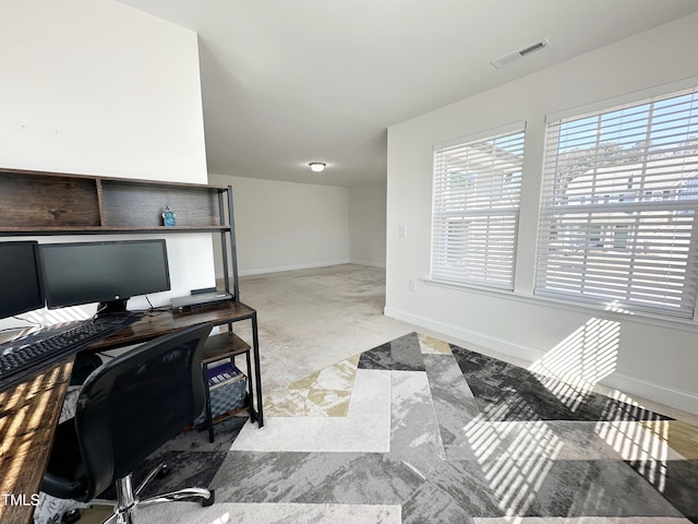 office area featuring visible vents and baseboards