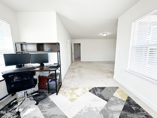 home office featuring baseboards and carpet flooring